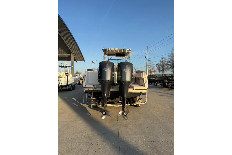 Slide: The Image of 1992 Grady White 300 Marlin boat with dual Yamaha 350 engines, parked outdoors. - 4