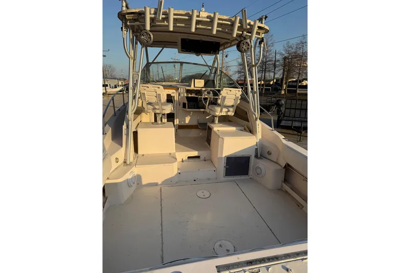 Slide: The Image of 1992 Grady White 300 Marlin boat interior with helm and seating area. - 5