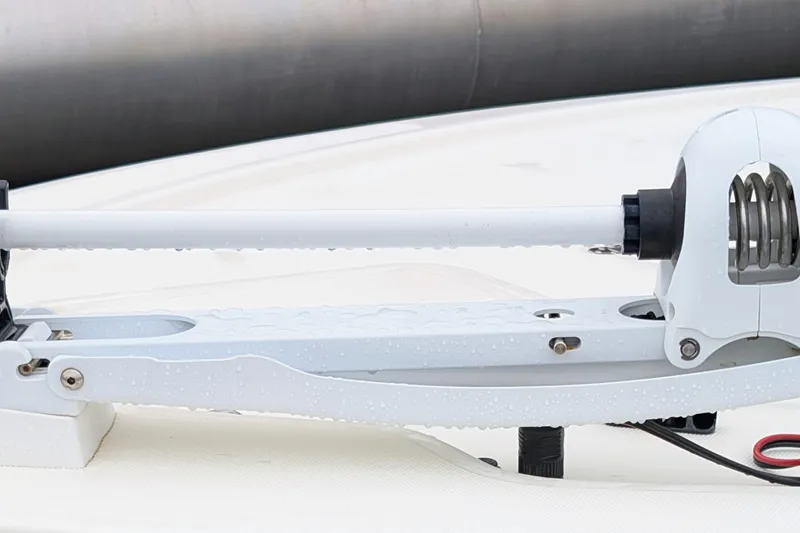 Slide: The Image of 2023 Mako 18 LTS boat detail with white trolling motor on deck. - 10