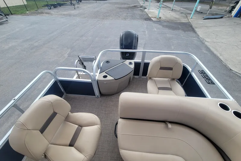 Slide: The Image of 2023 Sun Tracker Bass Buggy 18 DLX pontoon boat interior with beige seating. - 11