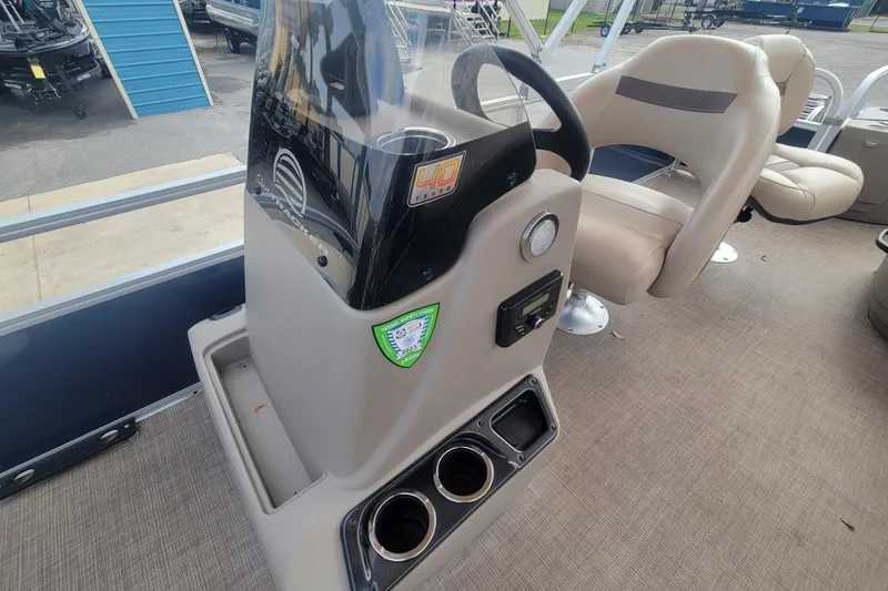Slide: The Image of 2023 Sun Tracker Bass Buggy 18 DLX interior with steering console and seating. - 17