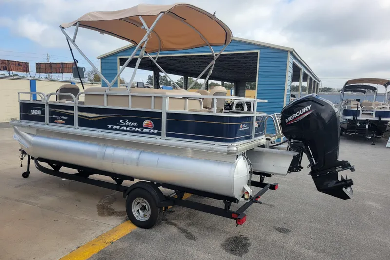 Slide: The Image of 2023 Sun Tracker Bass Buggy 18 DLX pontoon boat with Mercury outboard motor. - 4