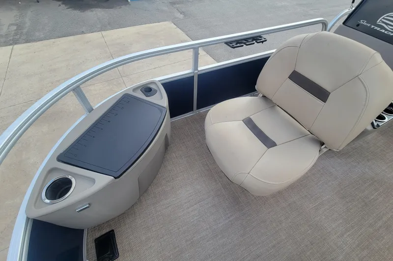 Slide: The Image of 2023 Sun Tracker Bass Buggy 18 DLX interior with seating and storage area. - 9