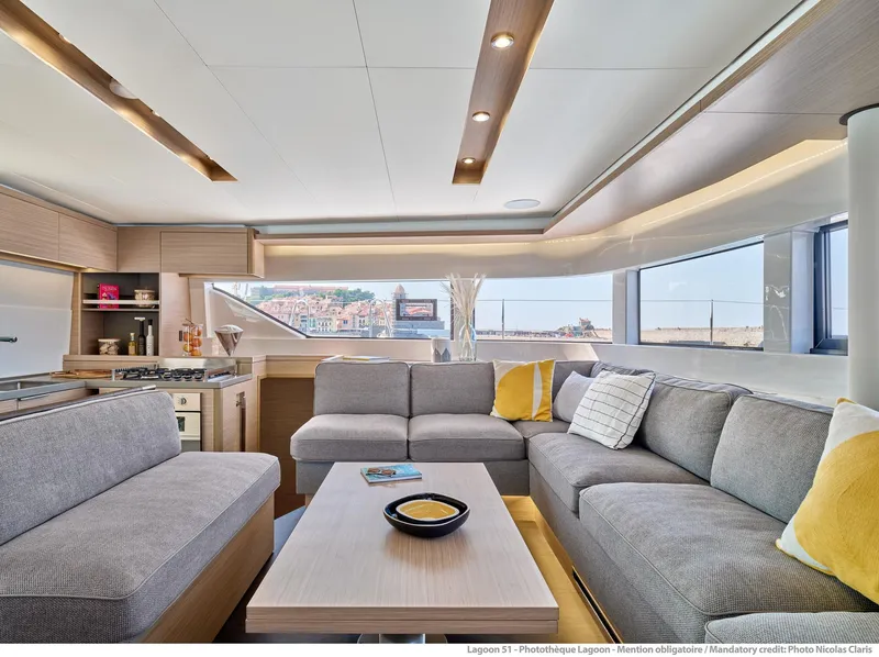 Slide: The Image of Luxurious interior of 2025 Lagoon 51 ICONIC yacht with modern seating and panoramic windows. - 31