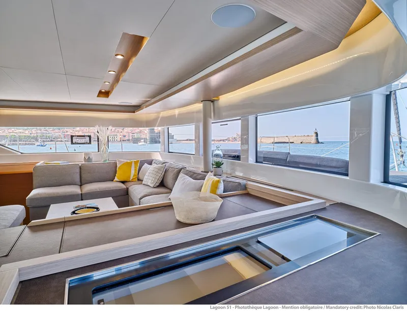 Slide: The Image of Luxurious interior of 2025 Lagoon 51 ICONIC yacht with panoramic windows and modern seating. - 36