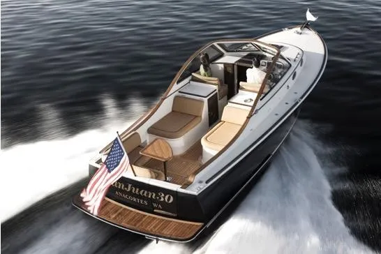 The Image of Luxury San Juan 30 boat cruising on water, 2008 model, with American flag displayed. - 0
