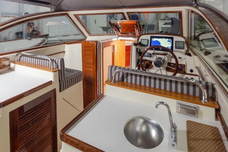 Slide: The Image of Interior of 2008 San Juan 30 boat with modern navigation equipment and seating. - 10
