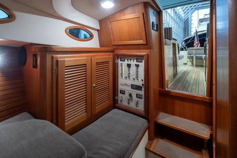 Slide: The Image of Interior of 2008 San Juan 30 yacht with wood paneling and control panel. - 22