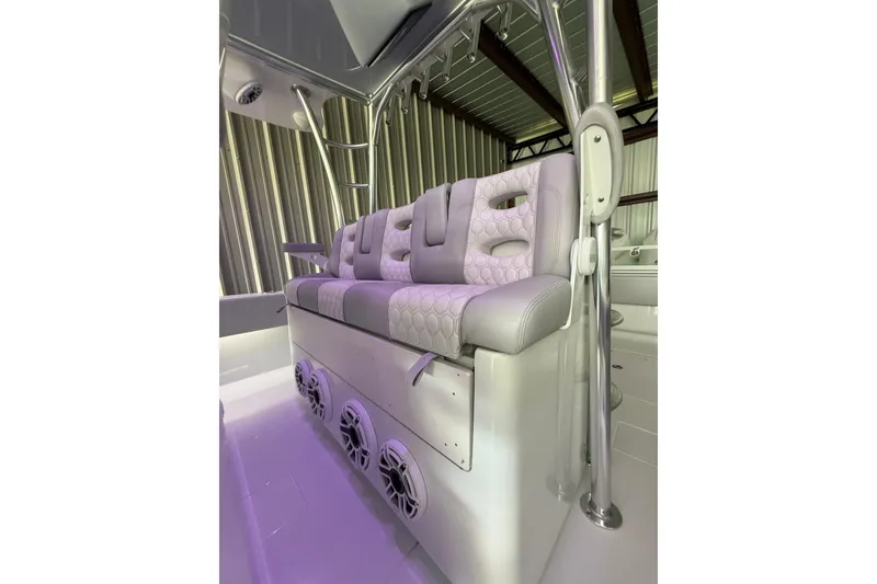 Slide: The Image of Luxurious seating in 2025 Contender 44 ST boat with modern design and integrated speakers. - 17
