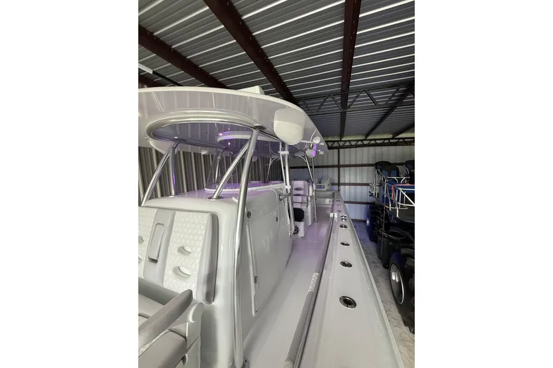 Slide: The Image of 2025 Contender 44 ST boat in storage, showcasing sleek design and modern features. - 9