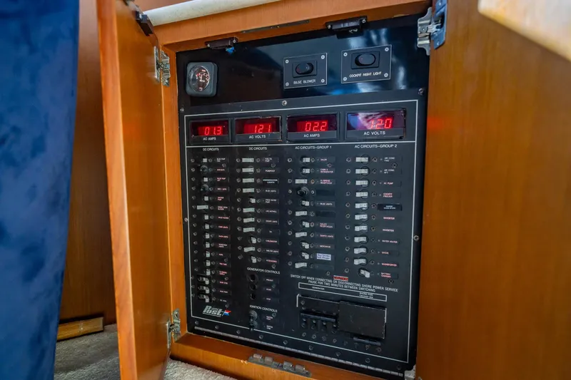 Slide: The Image of Electrical control panel inside a Post 42 model boat, year 2001, with switches and meters. - 10