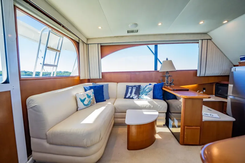 Slide: The Image of Luxurious interior of a 2001 Post 42 yacht with cozy seating and nautical decor. - 13
