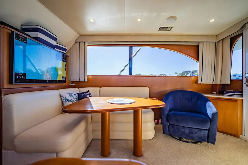 Slide: The Image of Luxurious yacht interior with seating, table, and large window, Post 42 model, 2001. - 15