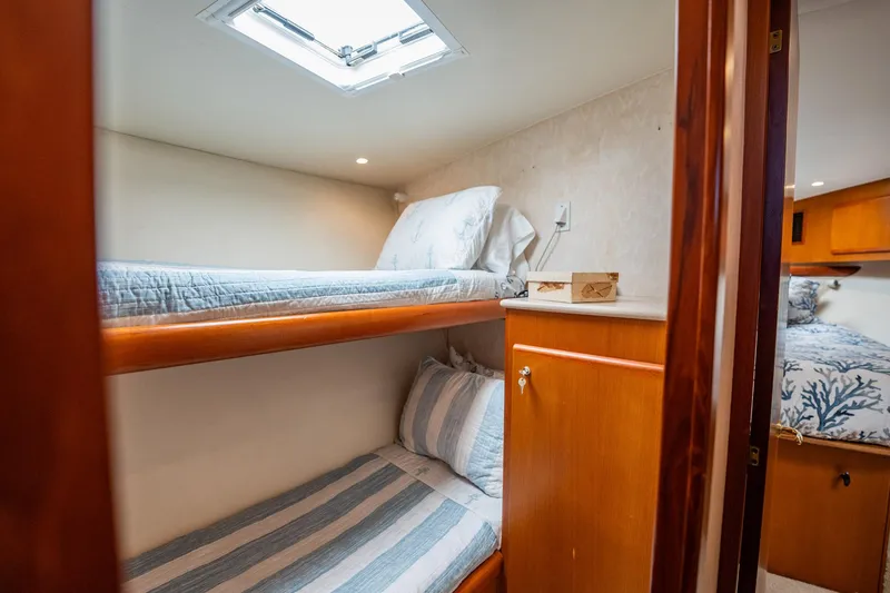 Slide: The Image of Cozy cabin interior with bunk beds in 2001 Post 42 yacht. - 21