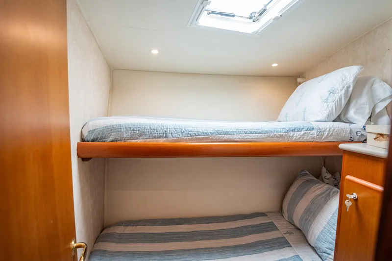 Slide: The Image of Compact cabin with bunk beds in a 2001 Post 42 model boat. - 22