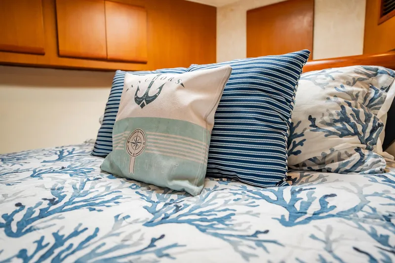 Slide: The Image of Nautical-themed bedding with anchor pillow on a Post 42 yacht, 2001 model. - 27