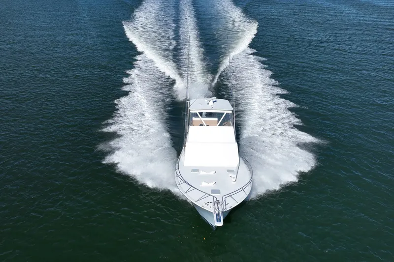 Slide: The Image of Aerial view of a 2001 Post 42 boat cruising on open water. - 37