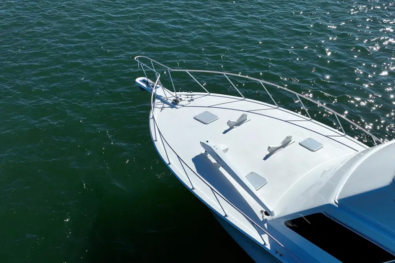 Slide: The Image of White yacht bow on sparkling water, Post 42 model, 2001. - 38