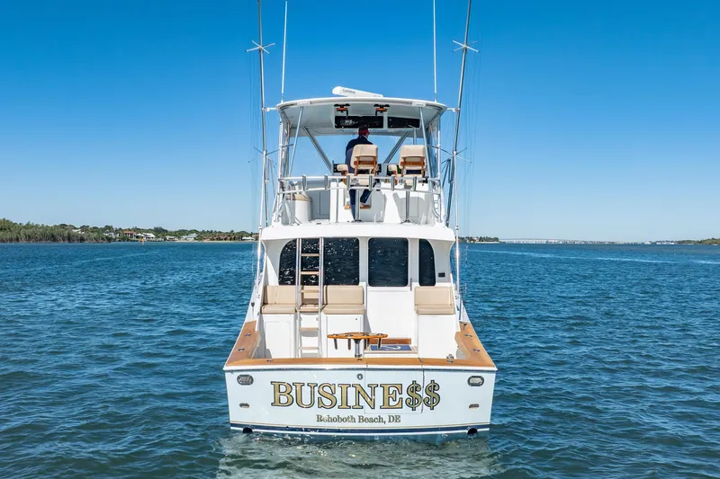 Slide: The Image of Luxury yacht "BUSINE$$" on water, Rehoboth Beach, DE, clear blue sky. - 4