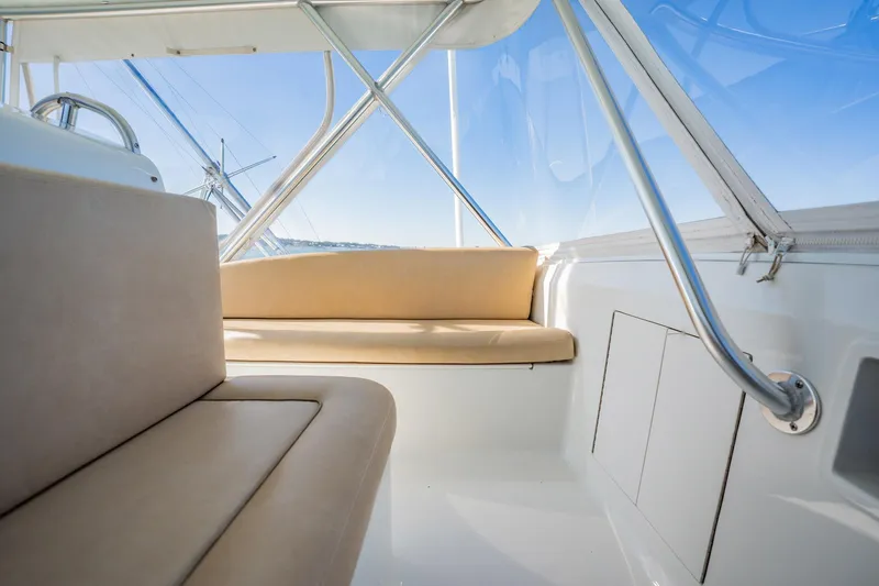 Slide: The Image of Interior of a 2001 Post 42 yacht with beige seating and metal railings. - 42