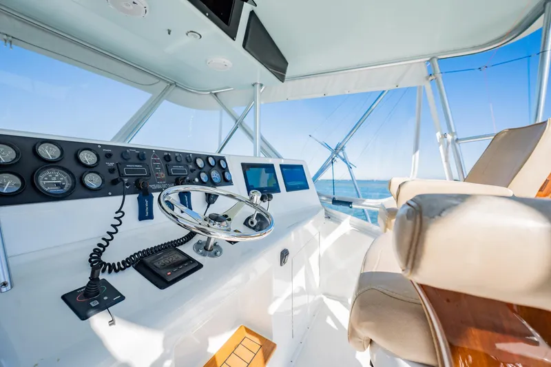 Slide: The Image of Luxurious yacht helm with modern controls, Post 42 model, 2001, overlooking the ocean. - 48