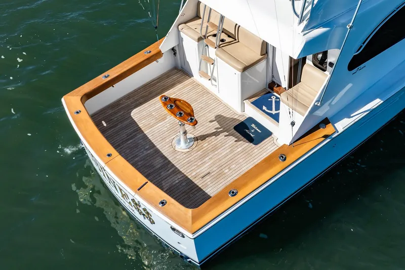 Slide: The Image of Aerial view of 2001 Post 42 yacht deck with wooden trim and seating. - 57