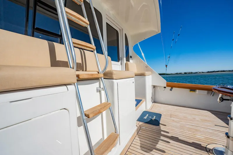 Slide: The Image of Luxury yacht deck with wooden steps and ocean view, Post 42 model, 2001. - 61