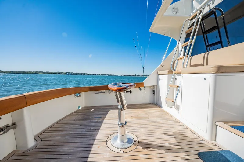 Slide: The Image of Luxurious 2001 Post 42 yacht deck with fishing chair, ocean view, and clear blue sky. - 63