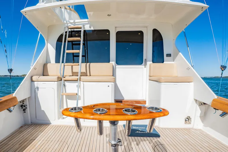 Slide: The Image of Luxury yacht deck with seating, ladder, and table; Post 42 model, 2001. - 64
