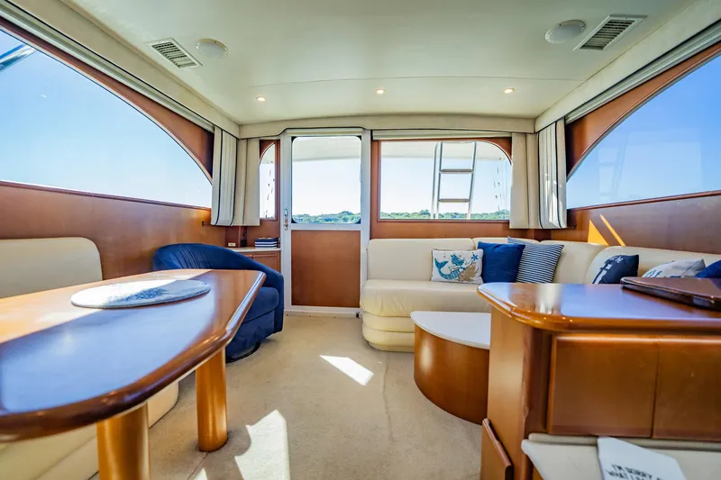 Slide: The Image of Luxurious interior of 2001 Post 42 yacht with elegant seating and natural light. - 7