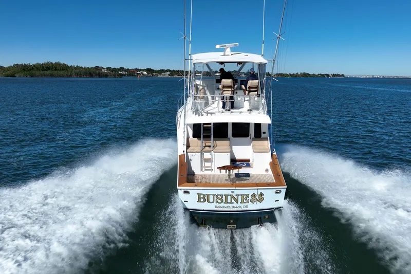 Slide: The Image of Luxury yacht "BUSINE$$" cruising on open water, Post 42 model, 2001. - 81
