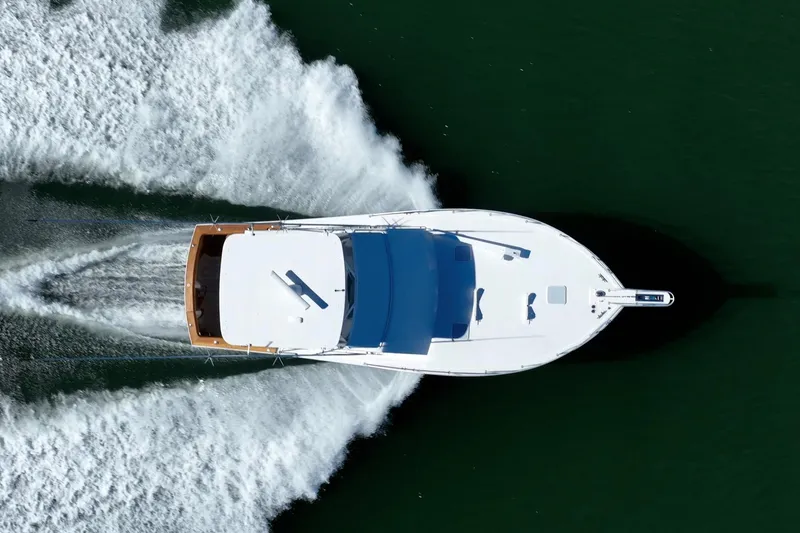 Slide: The Image of Aerial view of a 2001 Post 42 yacht cruising on water. - 83