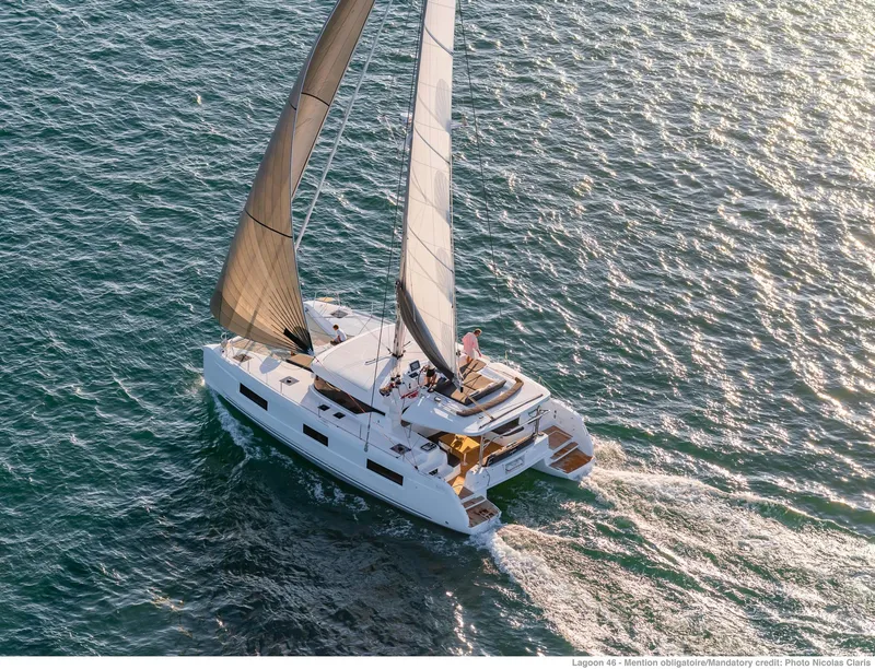 Slide: The Image of Aerial view of 2025 Lagoon 46 ICONIC catamaran sailing on open water. - 3