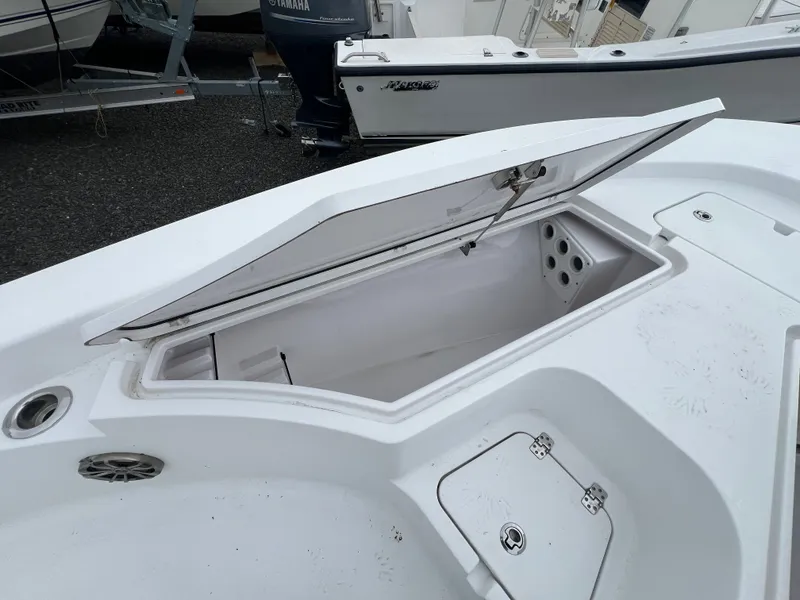 Slide: The Image of 2016 Sportsman Masters 227 Bay Boat with open storage compartment. - 10