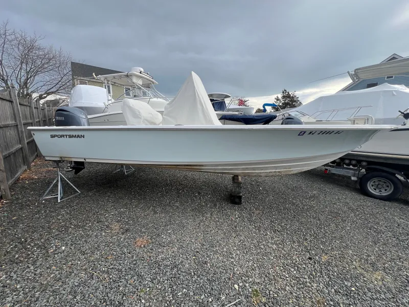 Slide: The Image of 2016 Sportsman Masters 227 Bay Boat on gravel lot. - 3