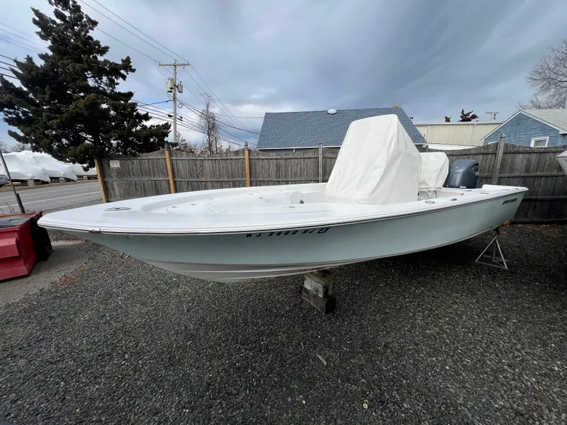 Slide: The Image of 2016 Sportsman Masters 227 Bay Boat on gravel lot. - 4