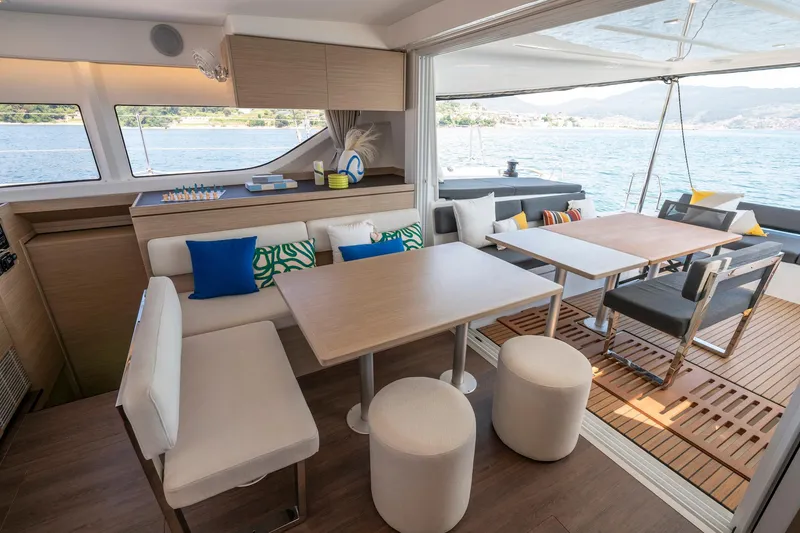 Slide: The Image of Luxurious interior of 2025 Lagoon 43 yacht with modern seating and ocean view. - 28