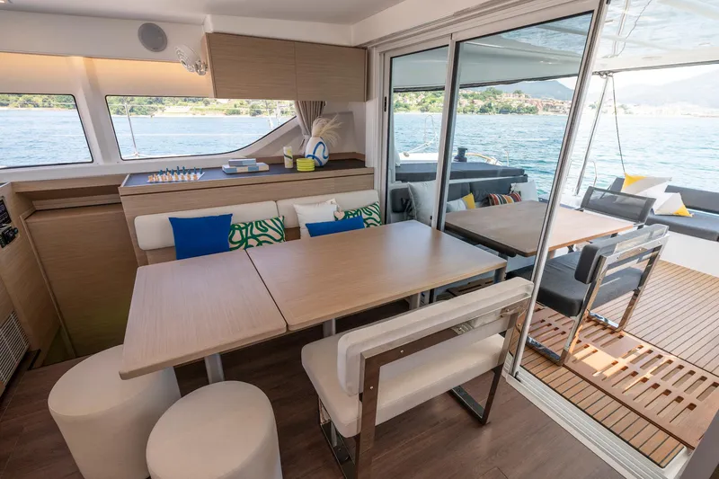 Slide: The Image of Modern interior of 2025 Lagoon 43 yacht with dining area and scenic water view. - 31