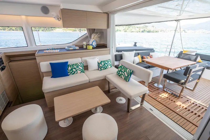 Slide: The Image of Luxurious interior of 2025 Lagoon 43 yacht with modern seating and scenic ocean view. - 36