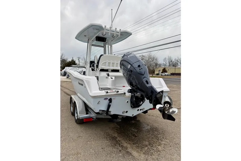 Slide: The Image of 2026 Tidewater 210 CC Adventure boat on trailer, featuring powerful outboard motor. - 12