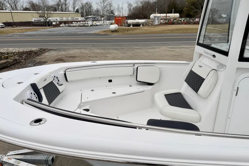 Slide: The Image of 2026 Tidewater 210 CC Adventure boat with spacious seating and modern design. - 24
