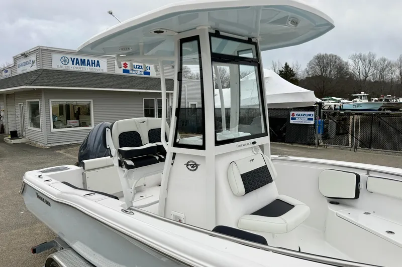 Slide: The Image of 2026 Tidewater 210 CC Adventure boat at dealership, featuring sleek design and modern amenities. - 27