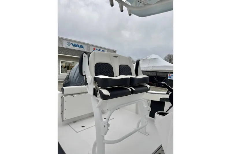 Slide: The Image of 2026 Tidewater 210 CC Adventure boat with dual seats, showcased at a dealership. - 29