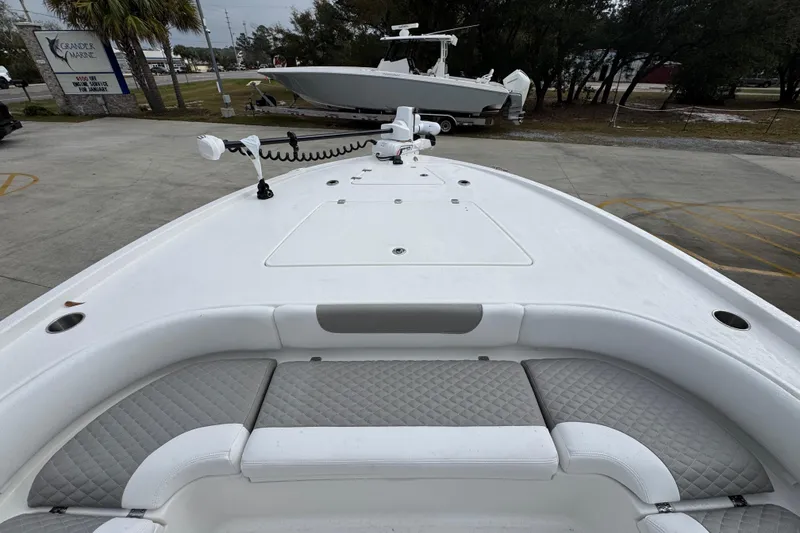 Slide: The Image of 2026 Caymas 281 HB boat with cushioned seating and deck view. - 19