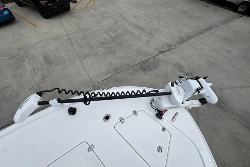 Slide: The Image of 2026 Caymas 281 HB boat with trolling motor on concrete surface. - 22