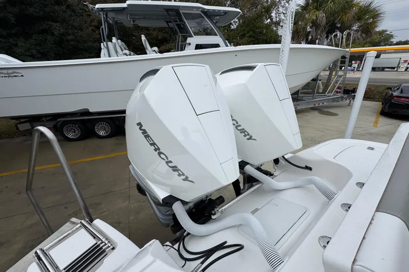 Slide: The Image of 2026 Caymas 281 HB boat with dual Mercury outboard engines on display. - 42