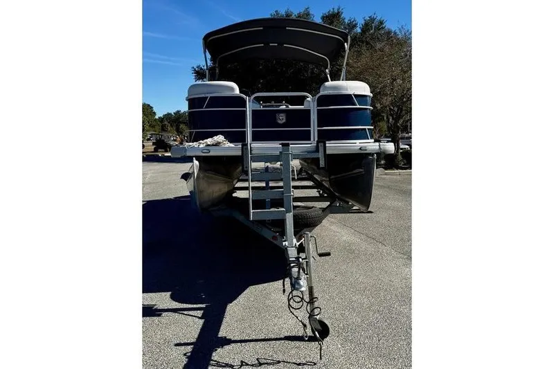 Slide: The Image of 2018 Godfrey Sweetwater 2086 C pontoon boat on trailer, parked outdoors. - 1