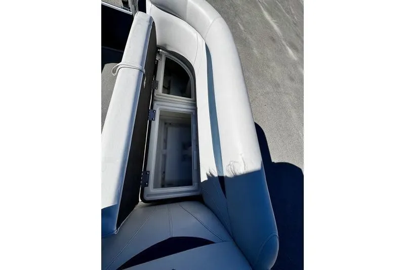Slide: The Image of 2018 Godfrey Sweetwater 2086 C boat seat with open storage compartment. - 10
