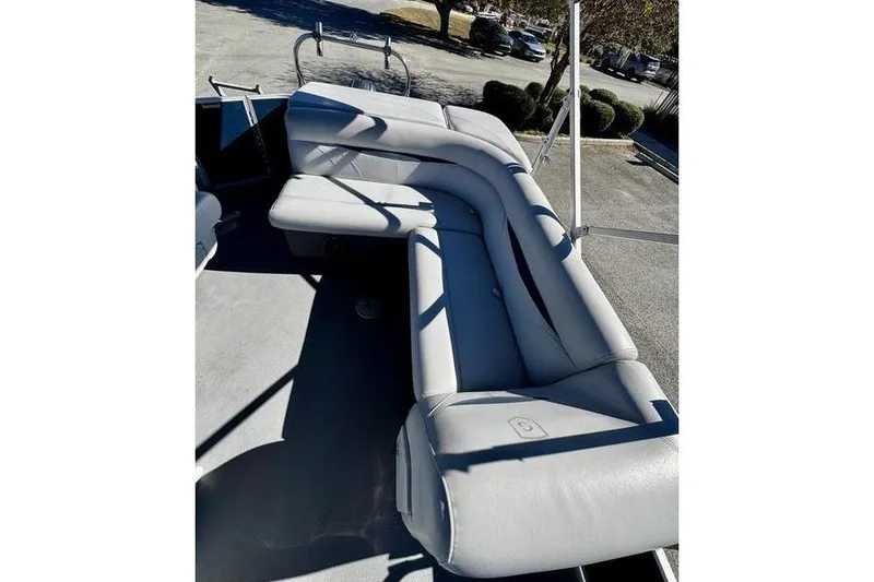 Slide: The Image of 2018 Godfrey Sweetwater 2086 C pontoon boat with gray seating and spacious deck. - 11