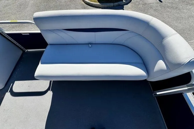 Slide: The Image of 2018 Godfrey Sweetwater 2086 C boat with curved seating and gray upholstery. - 12